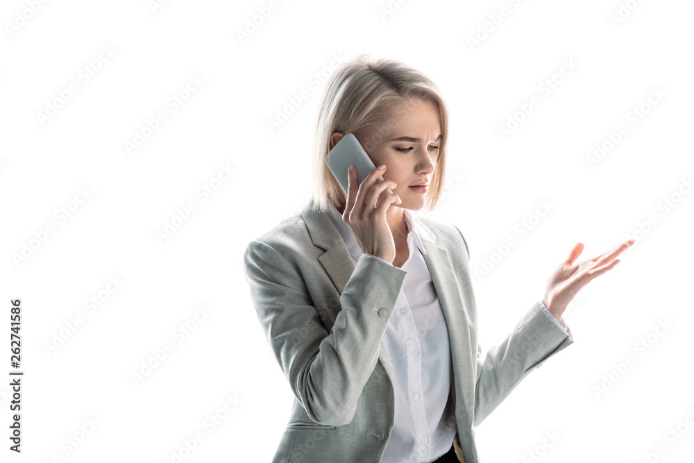 beautiful, serious businesswoman with blonde hair talking on smartphone isolated on white beautiful, serious businesswoman with blonde hair talking on smartphone isolated on white