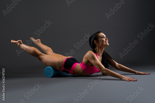 Gorgeous fitness model in pink sportswear shot photo