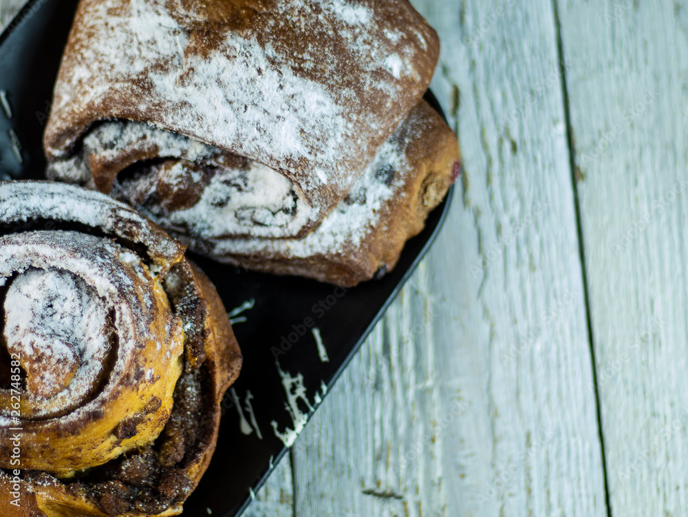 sweet buns on a rough wooden background sweet buns on a rough wooden background