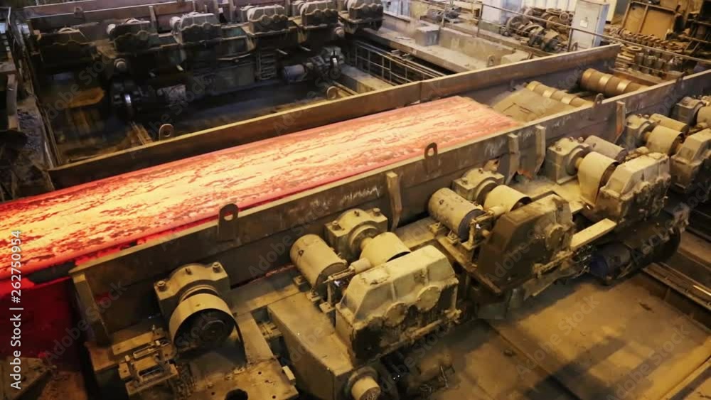 Steel mill, steel sheet production, transportation of hot sheets on the production line, heavy industry, metal rolling plant. Conveyor line metal rolling mill. Machine continuous casting blanks. Steel mill, steel sheet production, transportation of hot sheets on the production line, heavy industry, metal rolling plant. Conveyor line metal rolling mill. Machine continuous casting blanks.