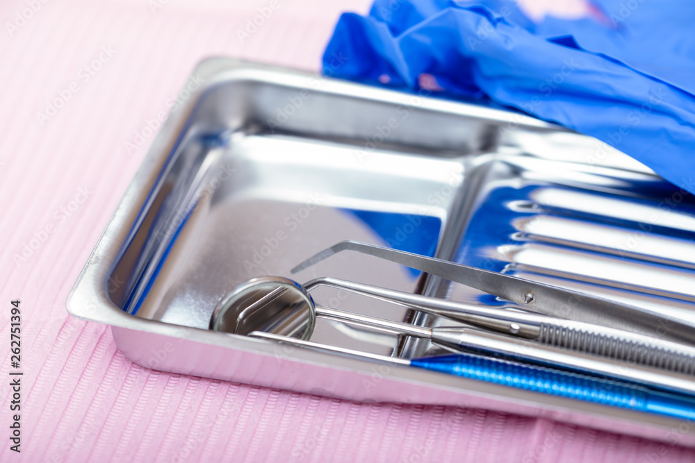 Sterilized dental instruments on a tray close-up Sterilized dental instruments on a tray close-up