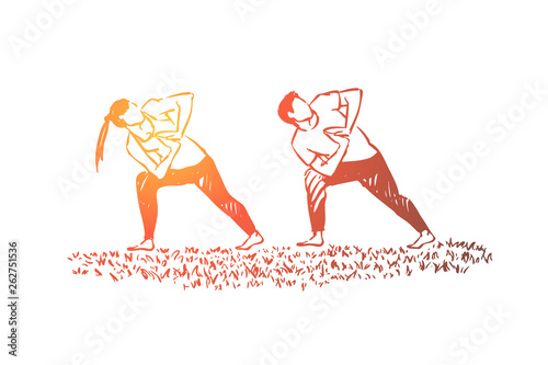 People in sportive clothes working out together, fitness coach and pupil, husband and wife doing gymnastics