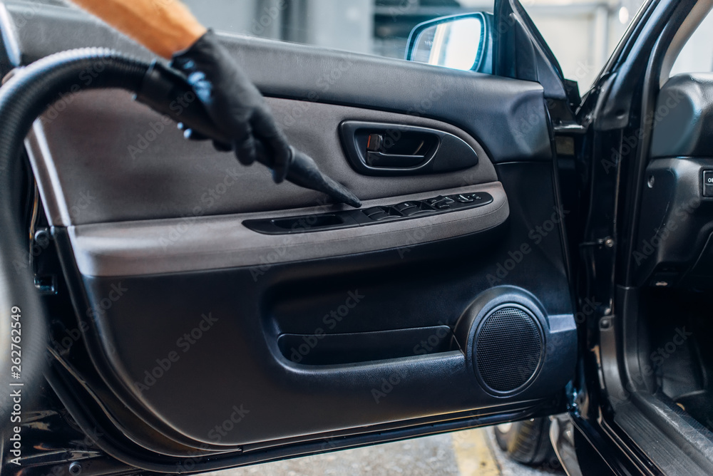Detailing, cleaning door trim with vacuum cleaner