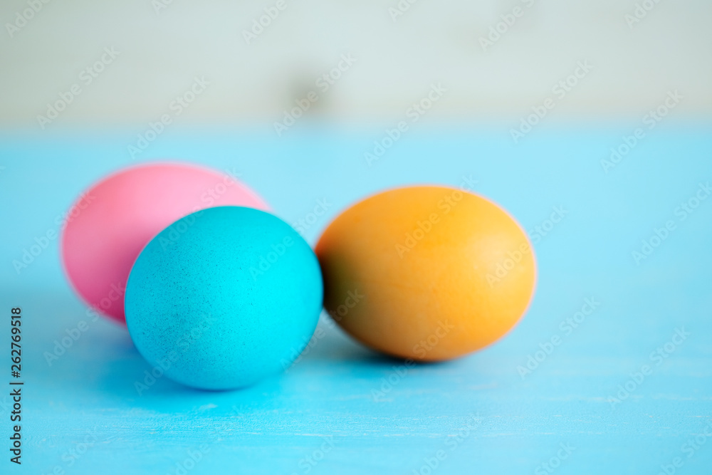 Easter painted eggs on a blue wooden table. soft focus Easter painted eggs on a blue wooden table. soft focus