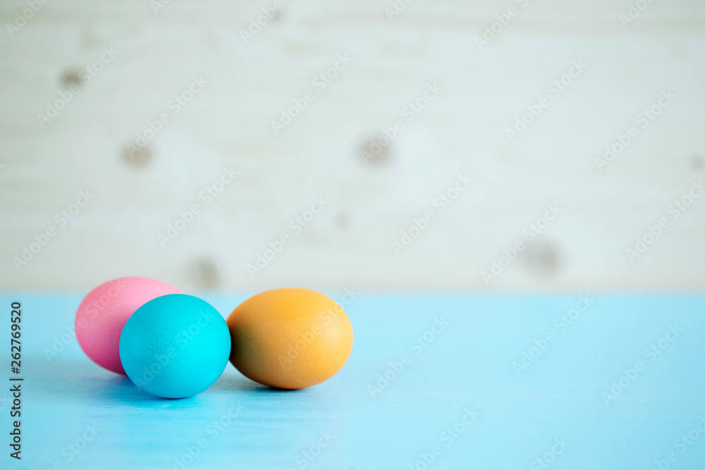 Easter painted eggs on a blue wooden table. very soft focus Easter painted eggs on a blue wooden table. very soft focus