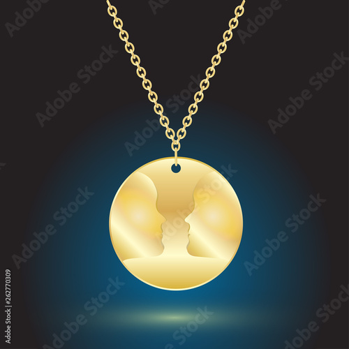 gold pendant jewelry on dark background with backlight.