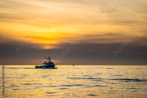 Beautiful Atlantic coastal shoreline scenery of lighthouses and lobster boats.