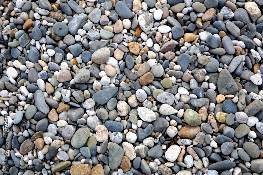 Textured pebbles on a rocky beach, from above Textured pebbles on a rocky beach, from above