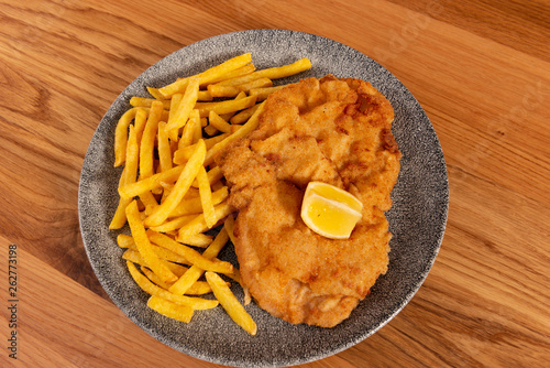 Wienerschnitzel mit Pommes Frites photo