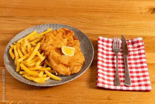 Wienerschnitzel mit Pommes Frites photo