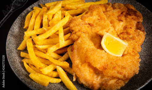 Wienerschnitzel mit Pommes Frites photo