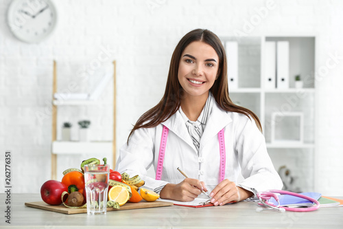 Portrait of female nutritionist in her office