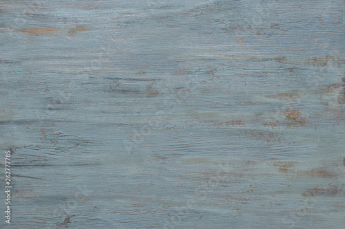 Light grey-bluish wooden texture with crackled paint. Aged grunge surface, copy-space