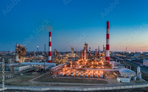 Russia. Ufa. April 2019. Башнефть Bashneft Flying above  chemical factory (refinery) in the late evening. Lights of night Ufa.