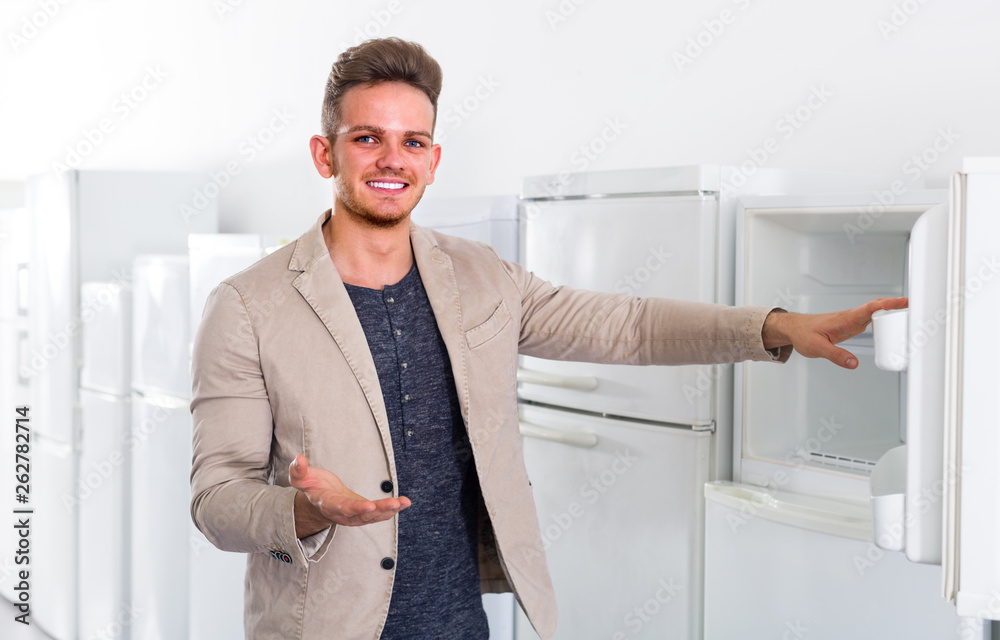 man choosing new refrigerator