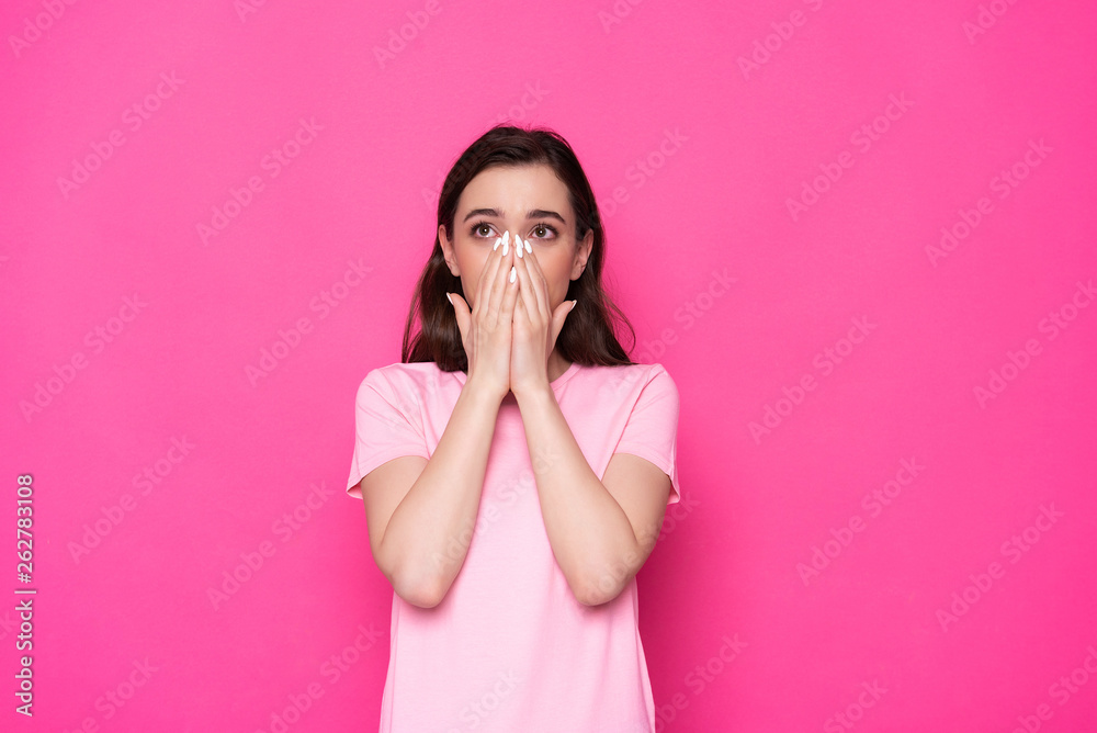 Waist up of surprised brunette Caucasian girl posing for camera in studio Waist up of surprised brunette Caucasian girl posing for camera in studio
