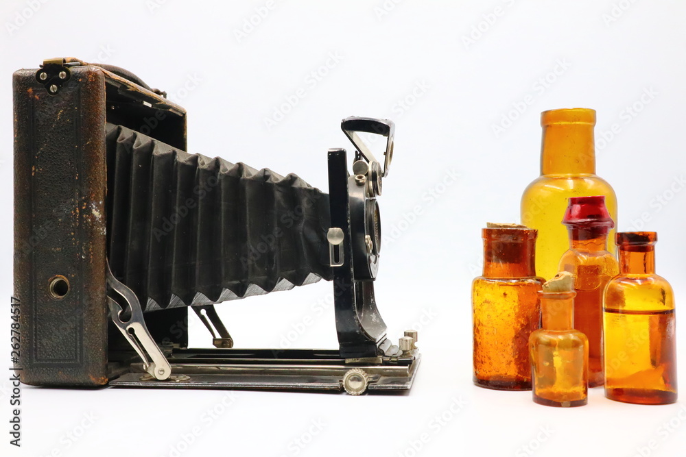 Composition of Antique Camera and Medicine Bottles Composition of Antique Camera and Medicine Bottles