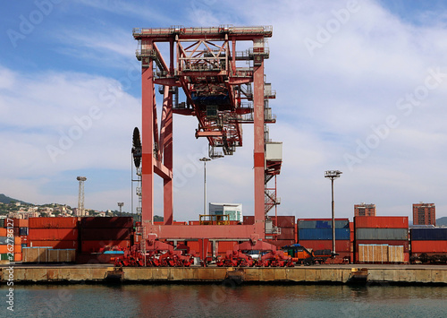 Liguria, Italy - Container terminal at the Genoa harbor photo