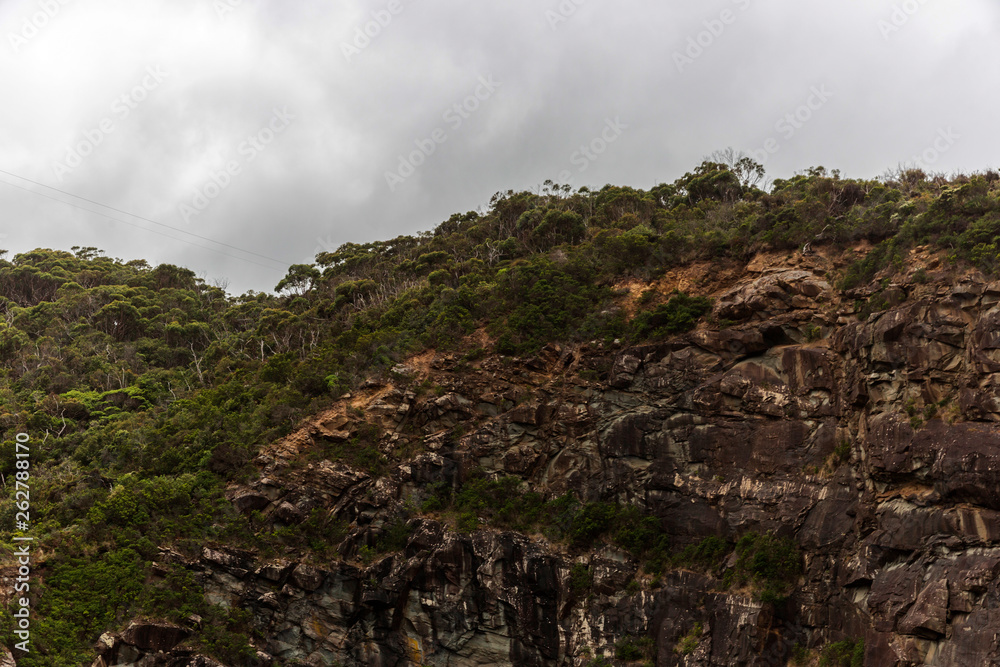 High rock wall along Great Ocean Road in Victoria Australia.