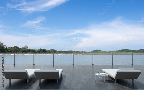 View of daybed with side table on wood terrace with sea view background. 3D rendering