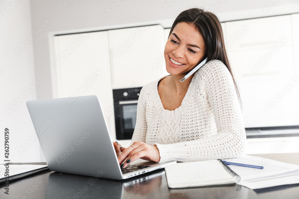 Attractive young woman working with laptop computer Attractive young woman working with laptop computer