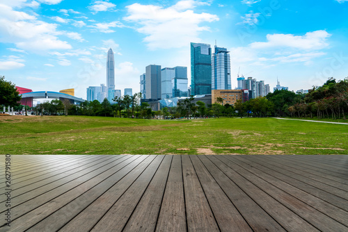 Empty square tiles and skyline of urban Architecture