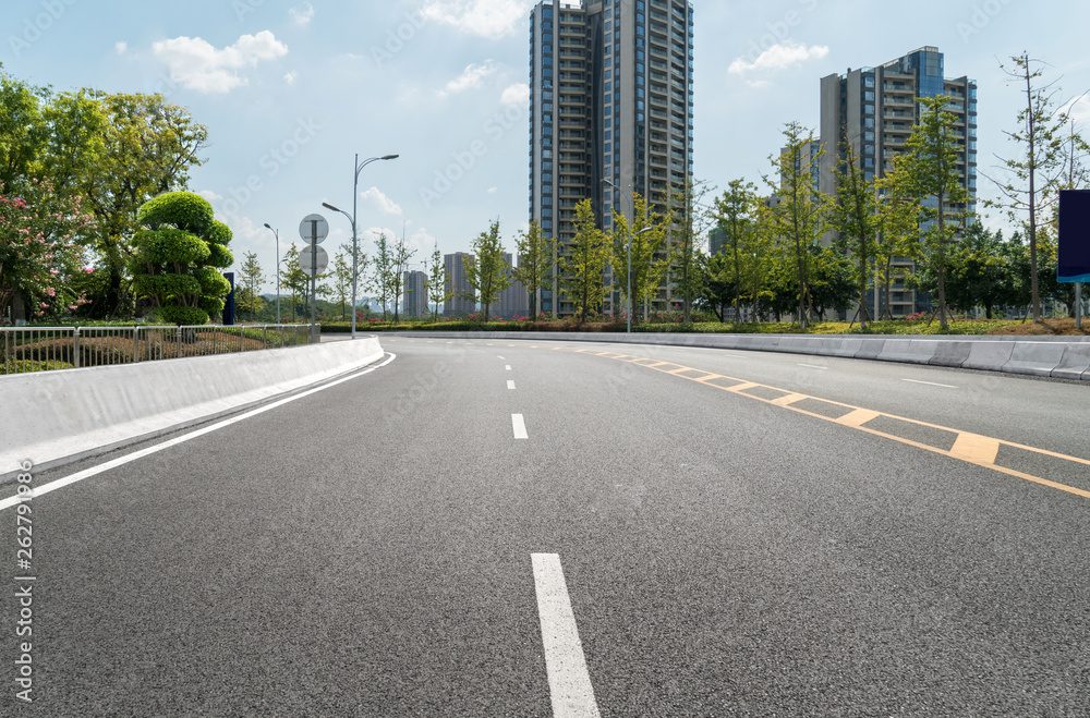 The expressway and the modern city skyline are in Chongqing, China.
