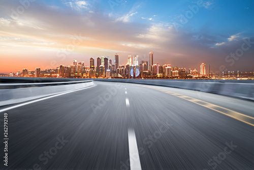 The expressway and the modern city skyline are in Chongqing  China.