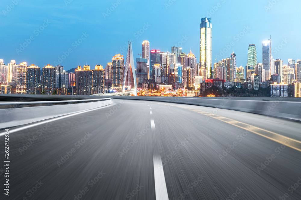 The expressway and the modern city skyline are in Chongqing, China.