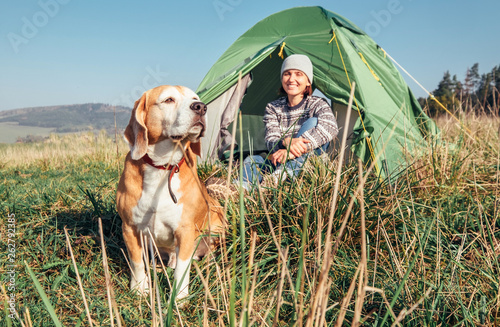 Photography Woman in her beagle dog meet morning in touristic camping tent