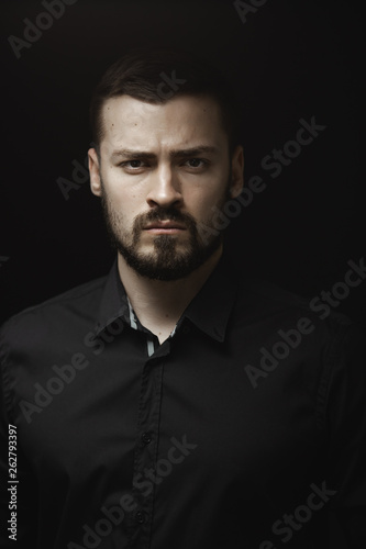 Portrait of Man in Black Indoors
