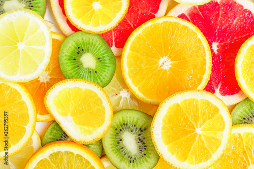 citrus slices - kiwi, oranges and grapefruits on white background. Fruits backdrop