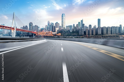 The expressway and the modern city skyline are in Chongqing  China.