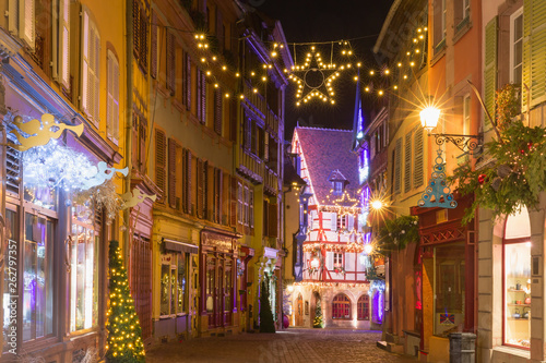 Christmas street at night in Colmar, Alsace, France © Kavalenkava