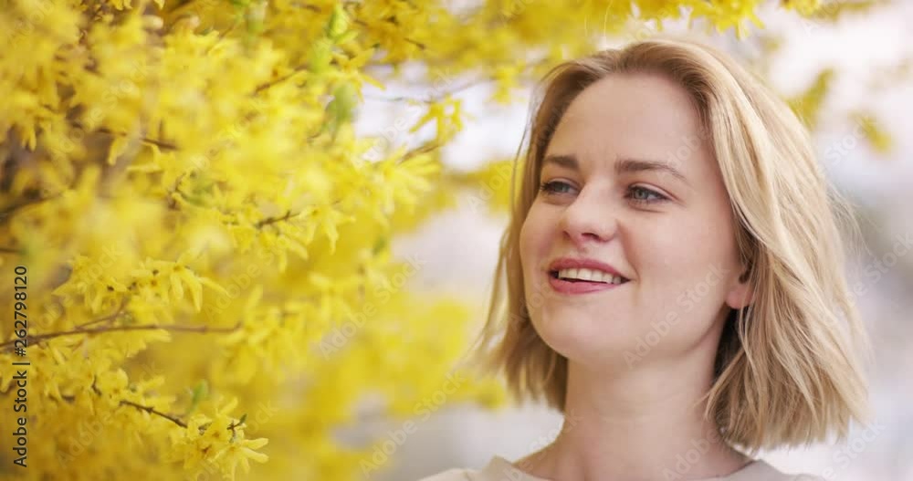 Beautiful girl happy about the first signs of spring Beautiful girl happy about the first signs of spring