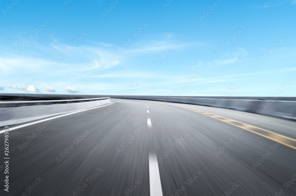 Motion-blurred highway in dusk clouds Motion-blurred highway in dusk clouds