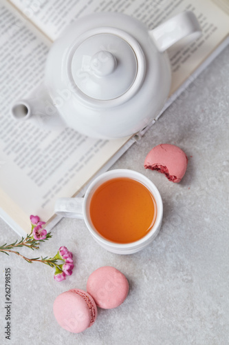 Leisure with book, tea and macaroons