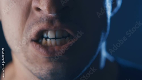 Close-up mouth of Aggressive Man screaming. Danger Violence. Angry man Shouting with Mouth wide open.