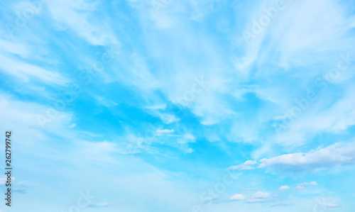 Blue spring sky with light clouds photo