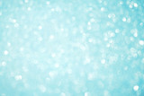 Blurred bokeh light blue party background, Christmas and New Year holidays background. Party concept. Festive holiday card bright backdrop. Defocused. Flat lay, top view, copy space.