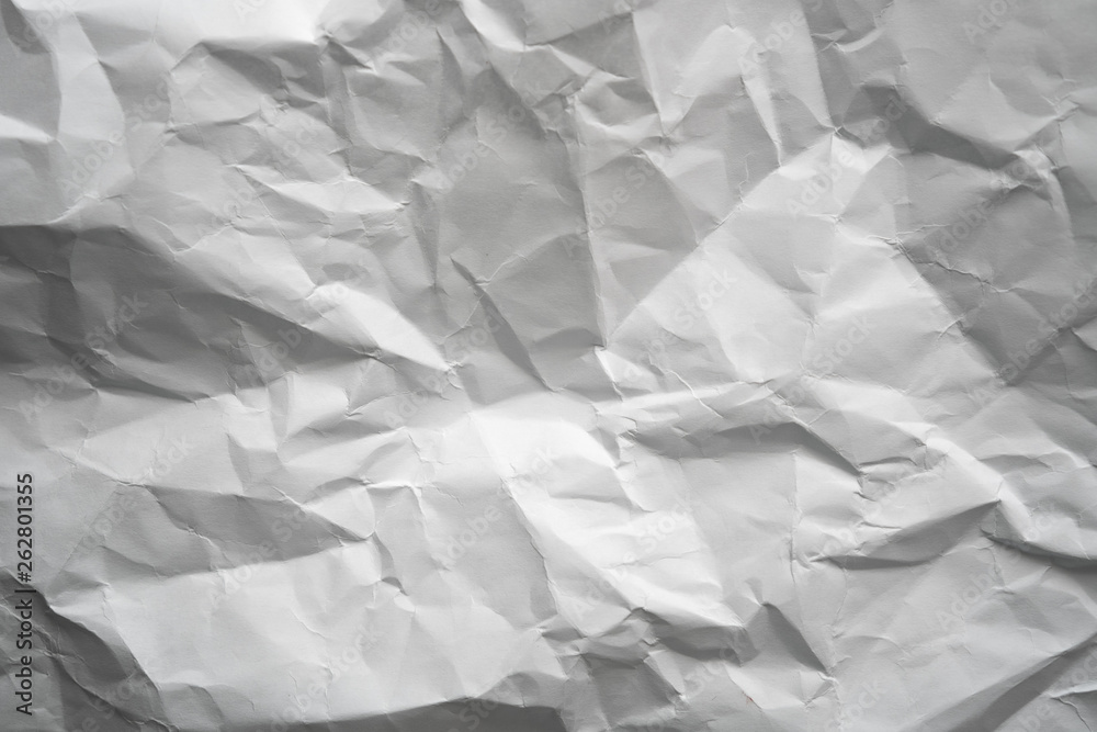 Obraz premium Crumpled gray paper with vignette background texture