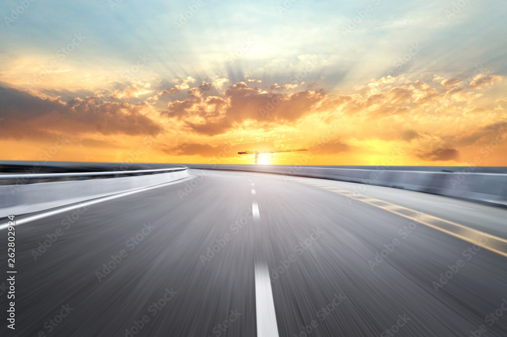 Motion-blurred highway in dusk clouds Motion-blurred highway in dusk clouds