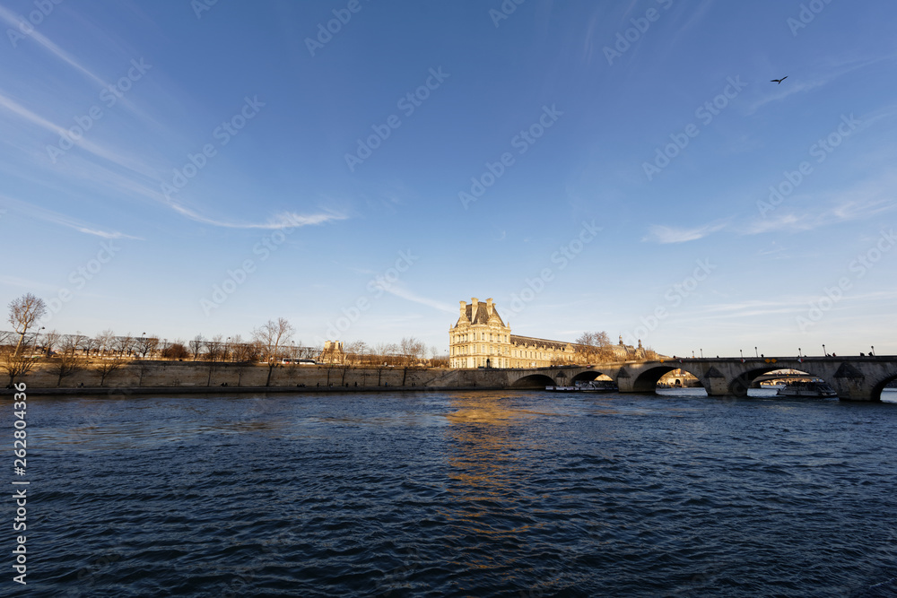 Louvre Palace near river Seine - Paris, France