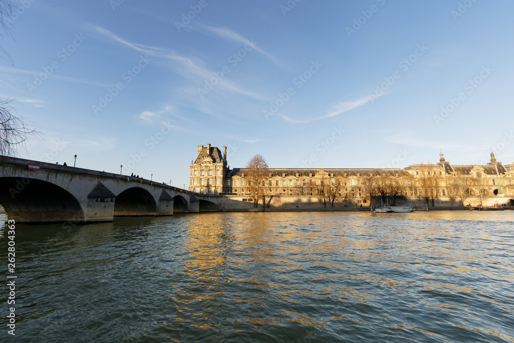 Obraz premium Louvre Palace near river Seine - Paris, France