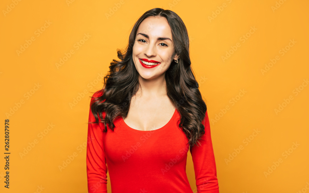 Being there. Gorgeous girl with smooth shiny long hair, deep brown eyes and brilliant smile is standing next to the camera and smiling sincerely. Being there. Gorgeous girl with smooth shiny long hair, deep brown eyes and brilliant smile is standing next to the camera and smiling sincerely.