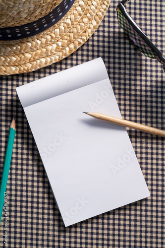 Notebook and pencils on the table