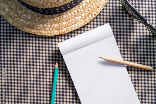 Notebook and pencils on the table