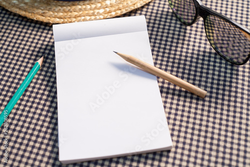 Notebook and pencils on the table