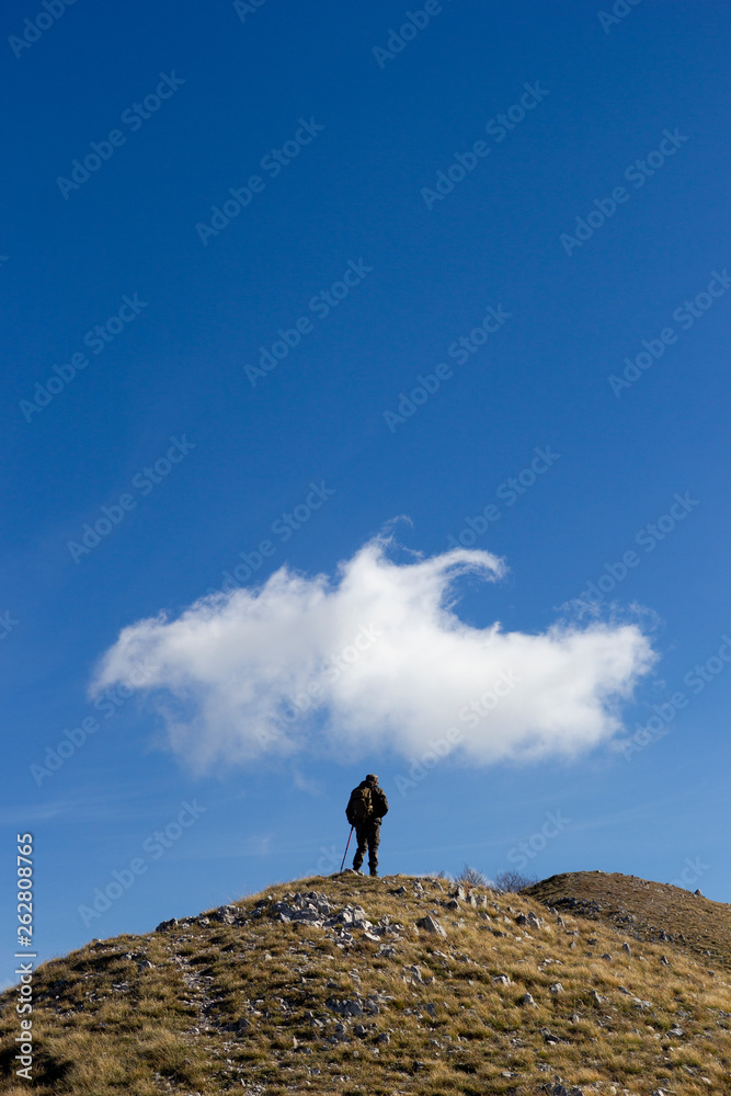 hiker on mountain peak mutria in italy matese hiker on mountain peak mutria in italy matese
