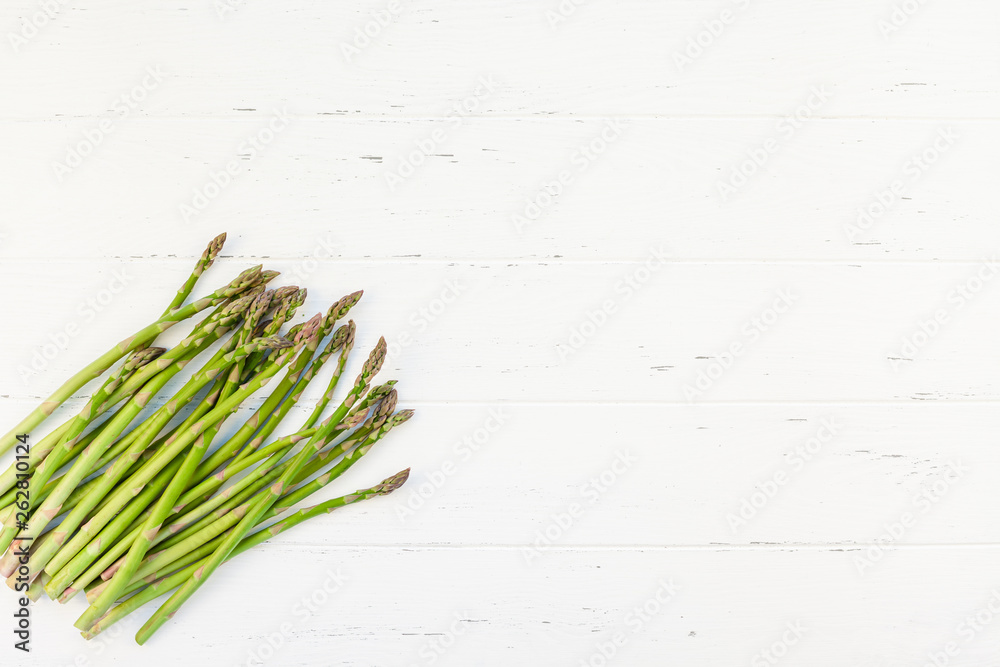 Fresh green asparagus on white wooden background Fresh green asparagus on white wooden background